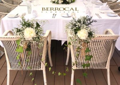 Main/ Top table, floral center and decoration of the bride and groom's chairs. Hydrangeas Liliums Roses. Lisianthus. Green.