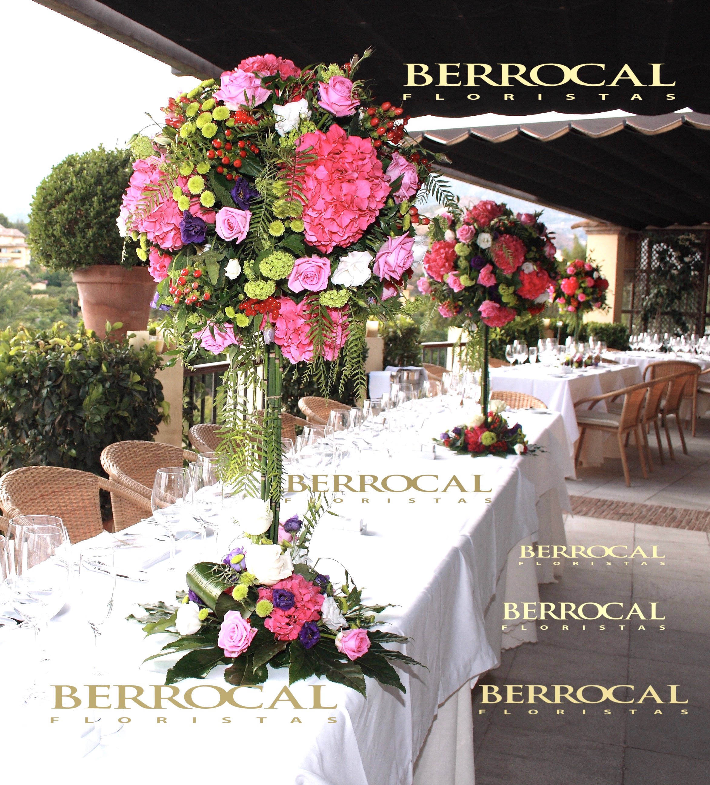 Tables on the terrace, floral compositions. Fuchsia Hydrangeas Roses. Lisianthus Hypericum Aralia leaf. Viburniun